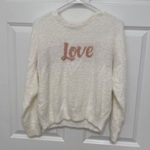 White sweater with light pink Love on the front. Size medium.